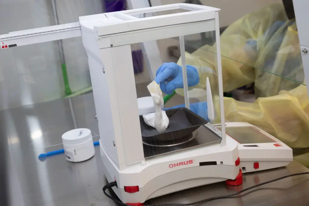 compounder using a scale